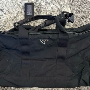 Prada nylon duffle with full zip, loc/keys & luggage tag. EUC